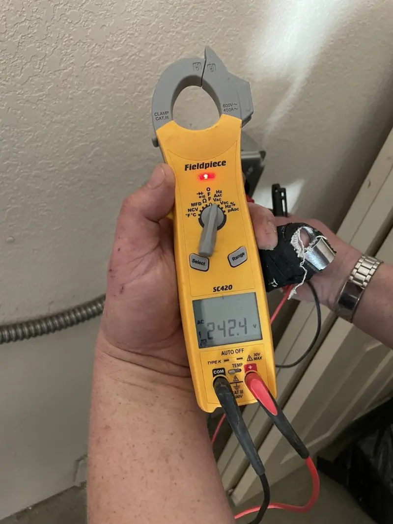 Voltage testing with clamp meter during Recessed Lighting Installation in Hidden Springs
